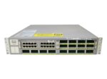 Przód switcha Cisco WS-C4900M z rzędami portów RJ45 i slotami X2, uszy montażowe na bocznych krawędziach obudowy.