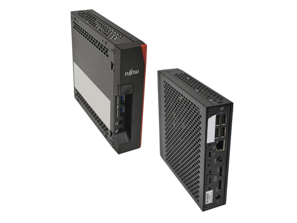 Dwa terminale Fujitsu FUTRO S7010 obok siebie, widok z boku na wentylację i z tyłu na porty USB i sieciowe.