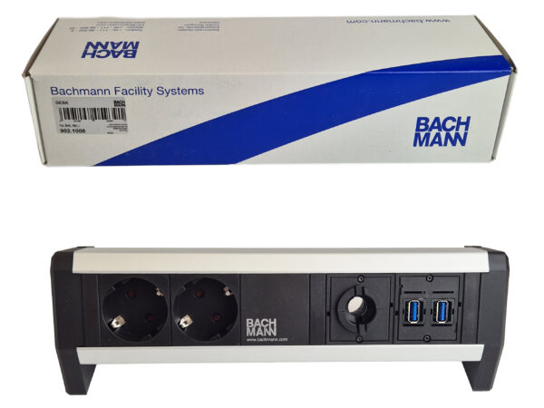 Listwa biurkowa Bachmann z dwoma gniazdami Schuko i portami USB obok oryginalnego pudełka producenta.