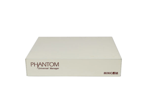 Obudowa KVM Minicom Phantom Universal Manager pod kątem z przodu, jasnoszara, z niewielkimi śladami zabrudzeń na obudowie.