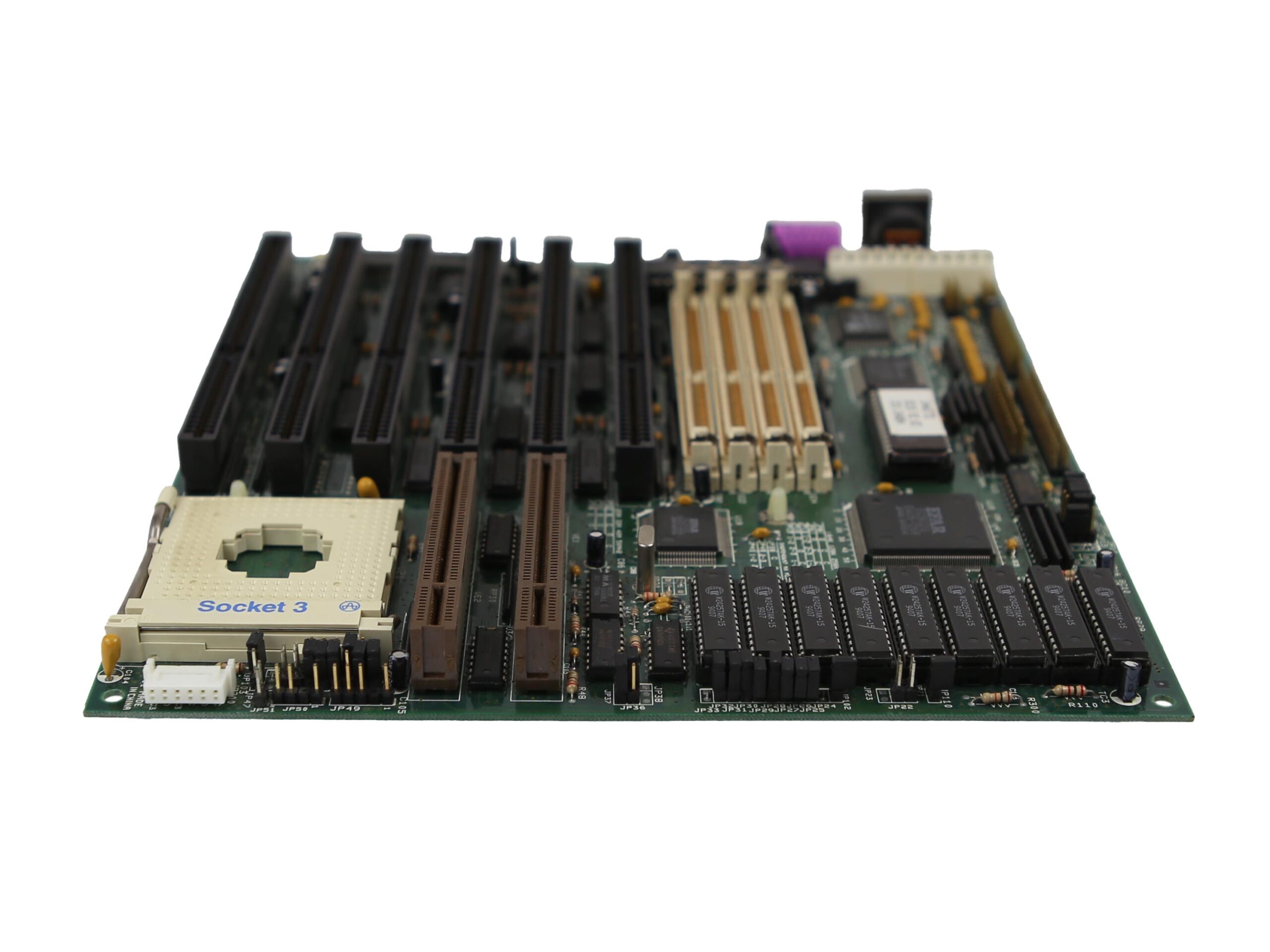 Płyta główna MiTAC widoczna pod kątem z boku, ze złączami slotów ISA i PCI oraz gniazdem procesora Socket 7 bez CPU