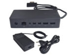 Stacja dokująca Microsoft Surface Dock z portami LAN, Mini DisplayPort i USB, obok zasilacz z kablem sieciowym.