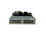 Moduł Cisco z dwoma rzędami po dziesięć portów RJ-45, widoczna metalowa obudowa z lekkimi śladami użytkowania.
