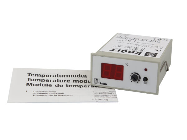 Moduł temperatury Knürr z czerwonym wyświetlaczem i pokrętłem, obok leży instrukcja obsługi w kilku językach.