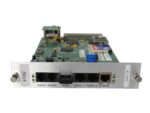 Karta kontrolna z odsłoniętą płytką PCB, na przednim panelu porty: modem, remote, alarm, dwa serial i network.