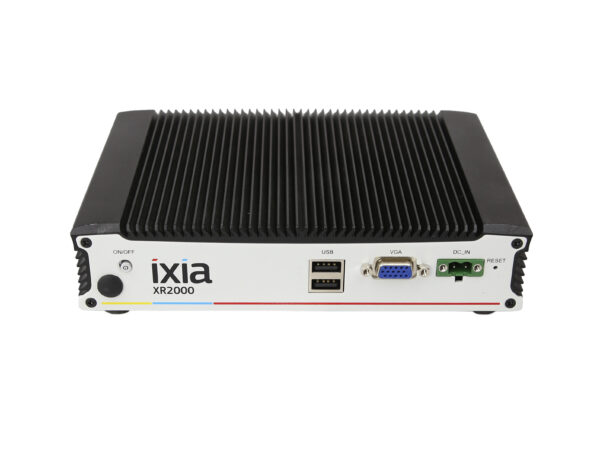 Przedni panel urządzenia Ixia XR2000 z widocznymi portami USB, VGA oraz złączem zasilania, obudowa z żebrowanym radiatorem.