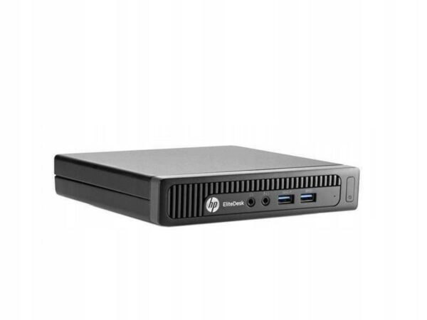 Komputer HP EliteDesk 800 G2 Tiny leżący płasko, widoczny przedni panel z portami USB i gniazdem słuchawkowym.