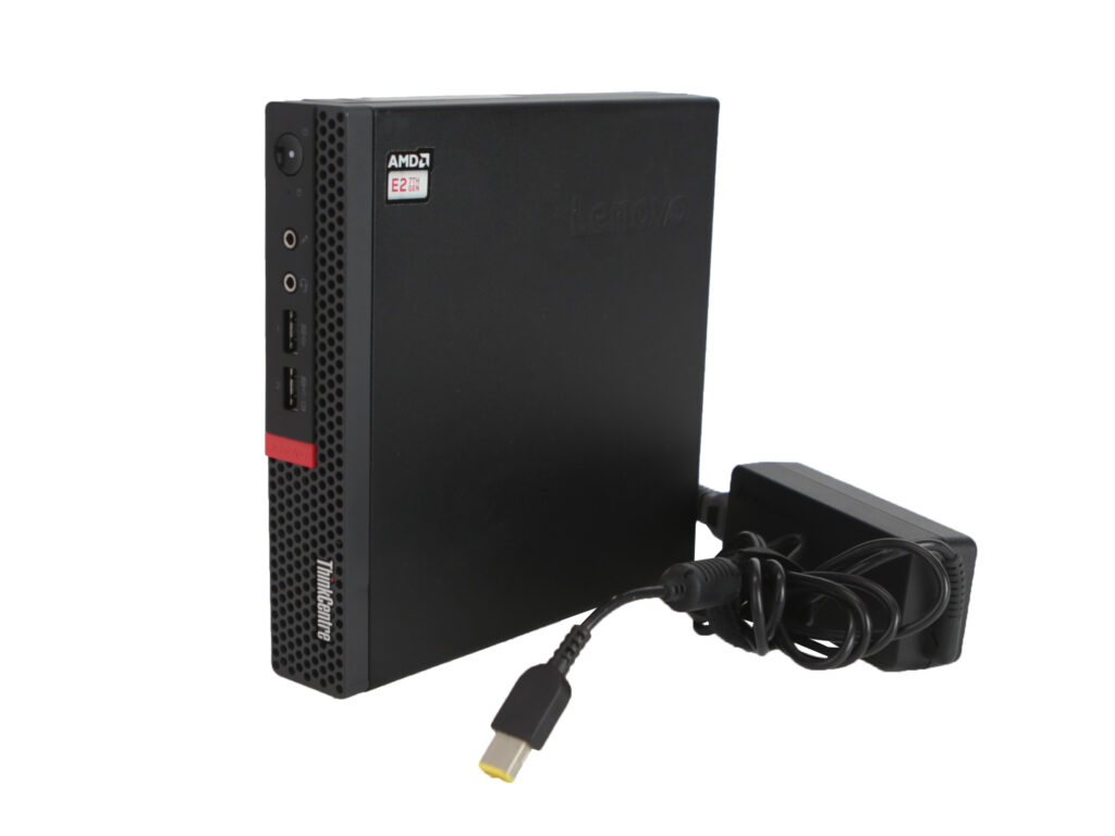 Mini komputer Lenovo ThinkCentre M625q ustawiony pionowo obok dołączonego zasilacza z kablem zasilającym.